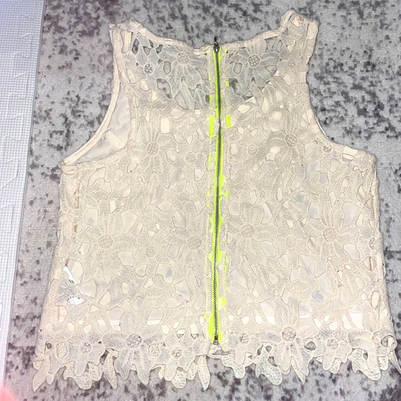 White lace crop top with neon green zipper at the back. Small - Picture 3 of 3